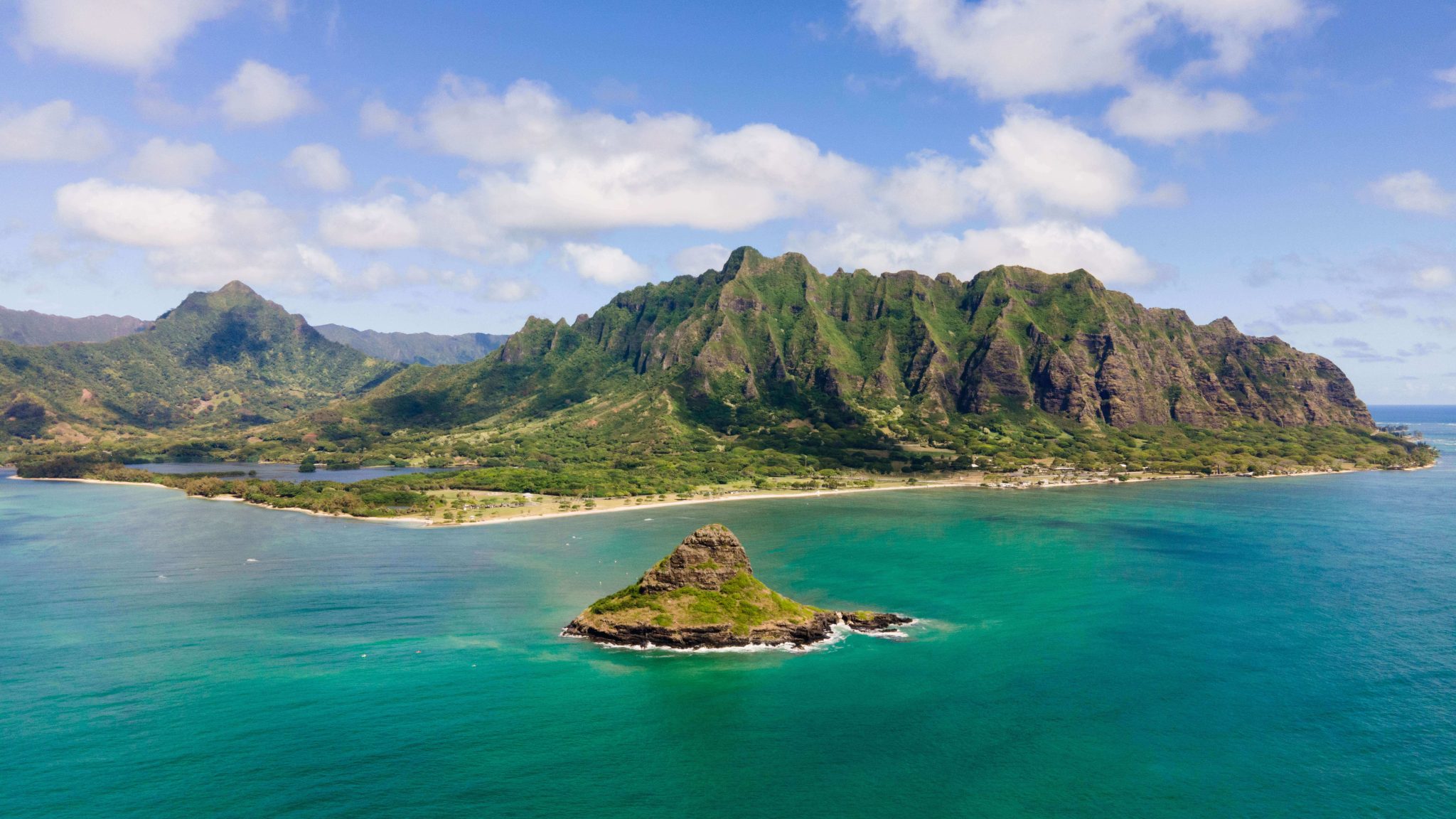 OAHU Aerial drone shot of Kualoa mountain range and Chinaman's Hat on